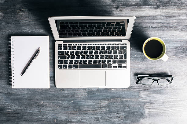 istock Wooden desk with items 595733472