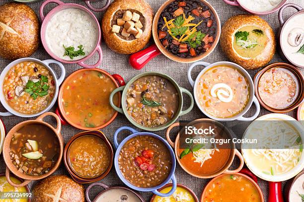 Variety Of Garnished Soups In Colorful Bowls Stock Photo - Download Image Now - Soup, Food, Multiracial Group