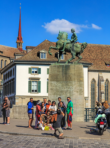 Zurich, Switzerland - 21 August, 2015: tourists at the monument to Hans Waldmann in the historic part of the city. Zurich is the largest city in Switzerland, it is also the capital of the Swiss canton of Zurich.