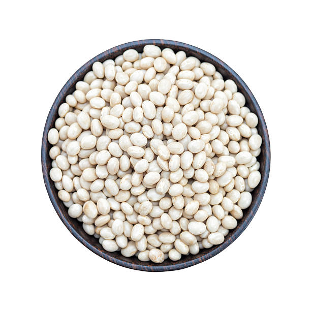 istock Navy beans in bowl isolated on white background 595737286