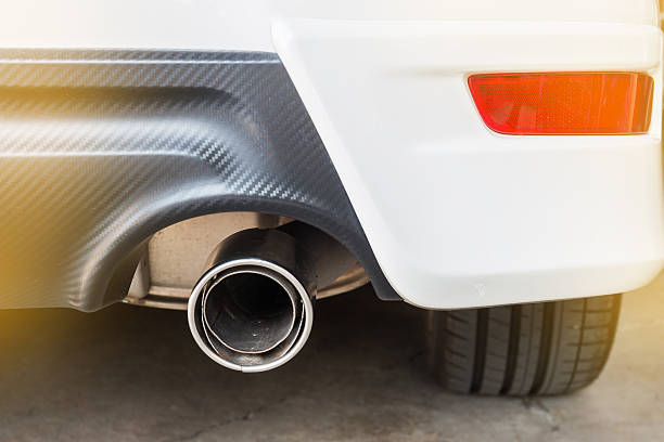 istock Chrome pipe of white powerful sport car bumper 595737598