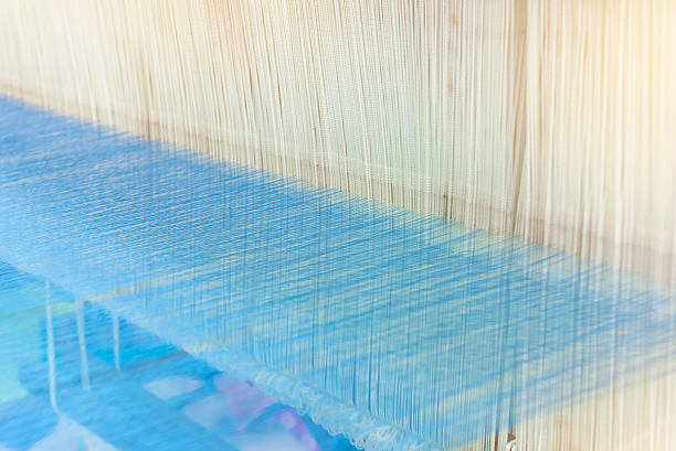 istock Weaving loom and shuttle on the warp 595738356