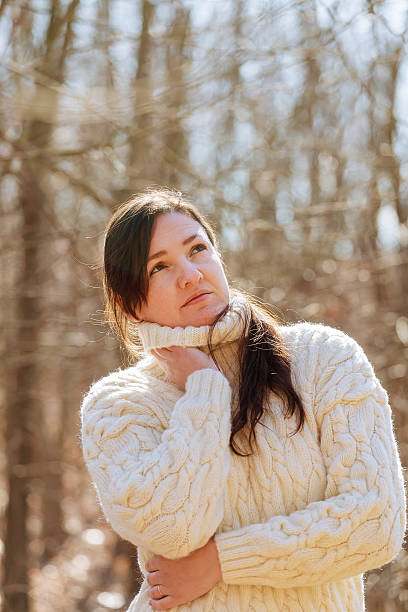 istock beautiful woman in spring forest 595739972