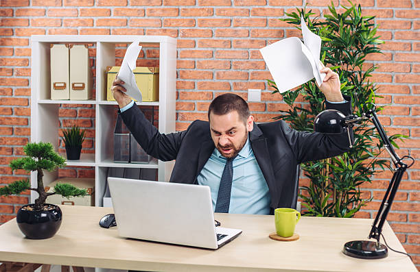 istock Angry businessman at office 595740248
