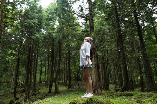 Woman at the center of the sacred forest.