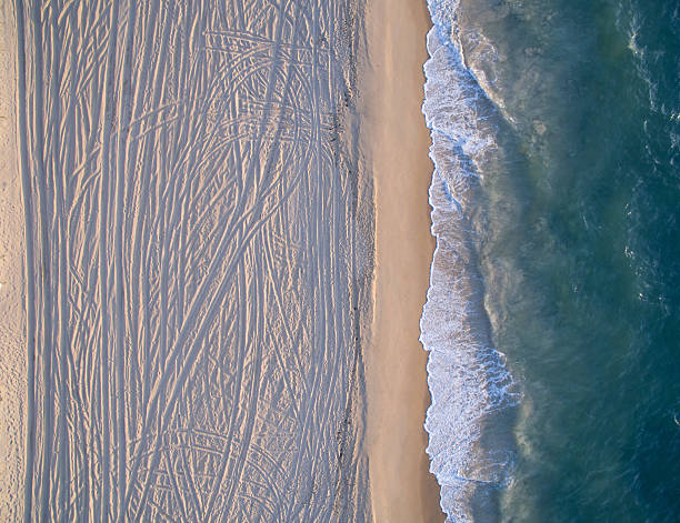 istock Aerial View of where Waves meet the Pattern Sandy Beach 595743488