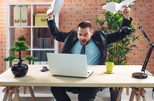 istock Angry businessman at office 595743842