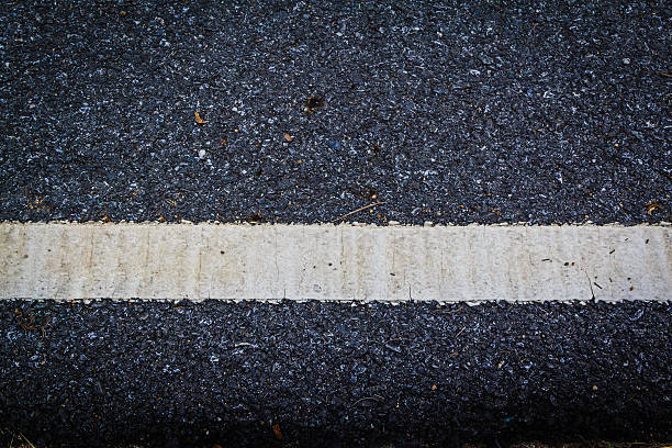 istock lines and tire tracks. Close up photo with selective focus 595746018