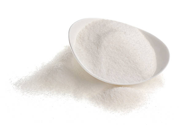 istock Bowl of sugar isolated on white background 595749404