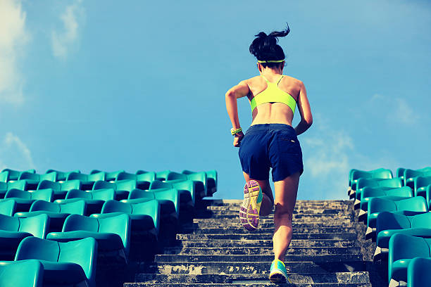 istock Runner athlete running on stairs. 595749516