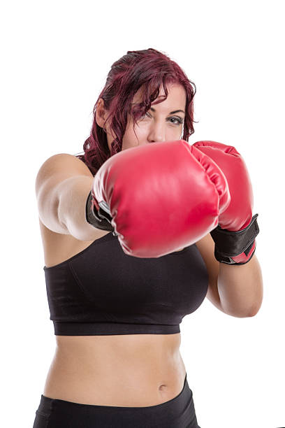 istock woman wearing boxing gloves 595750142