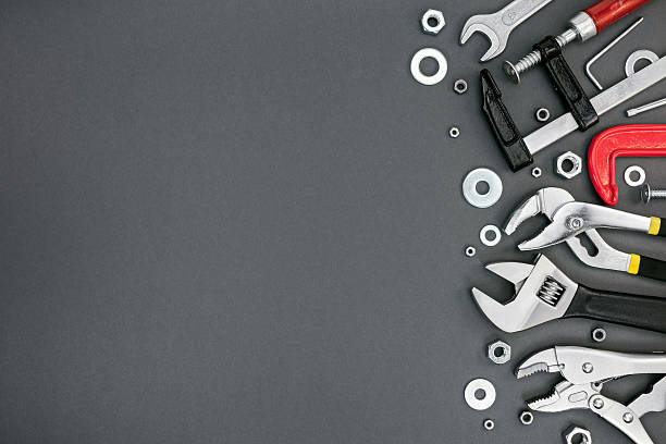 istock set of different adjustable wrenches and clamps on grey table 595750276