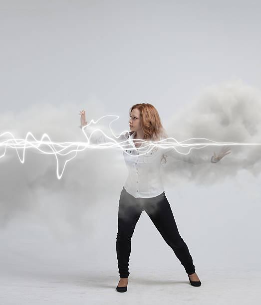 istock Woman making magic effect - flash lightning. The concept of 595752260