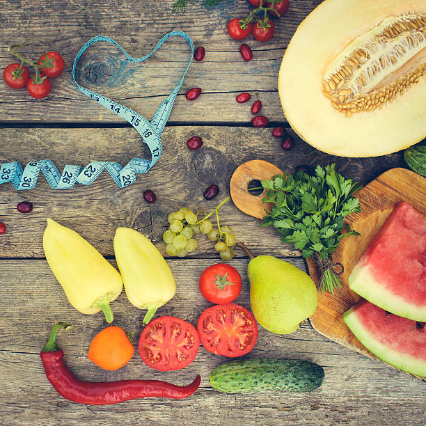 istock Fruits, vegetables and in measure tape in diet 595752732