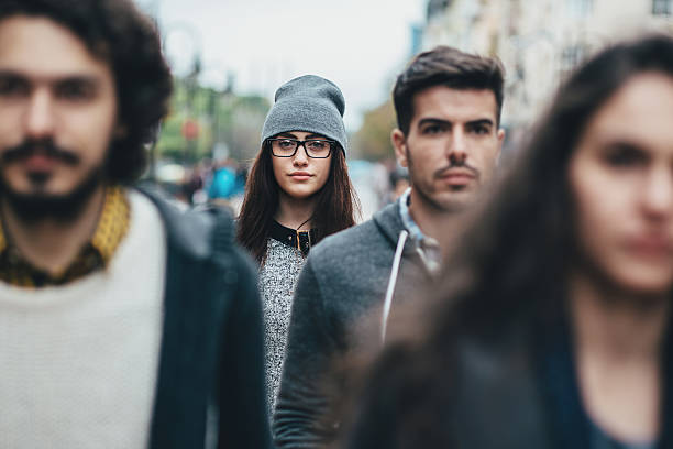 istock Young woman in the crowd 595753134