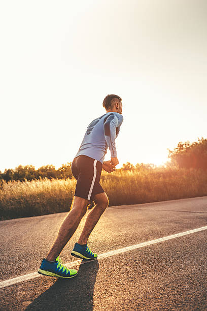 istock Fit young man running in sunset 595755884