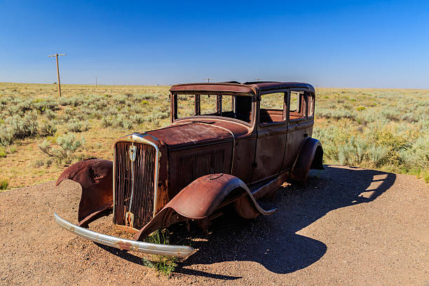 istock Ancient car alone in the Desert. 595757368