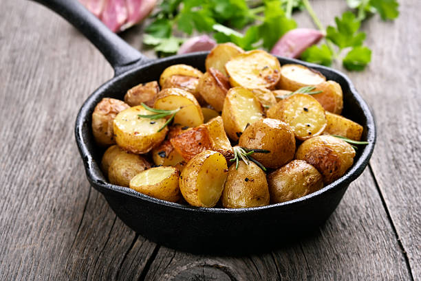 istock Fried potato in frying pan 595757538