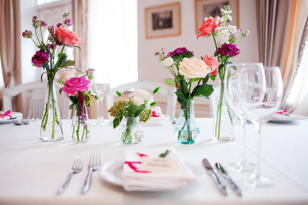 istock Wedding banquet, small restaurant. Floral decor in red, informal style. 595758986