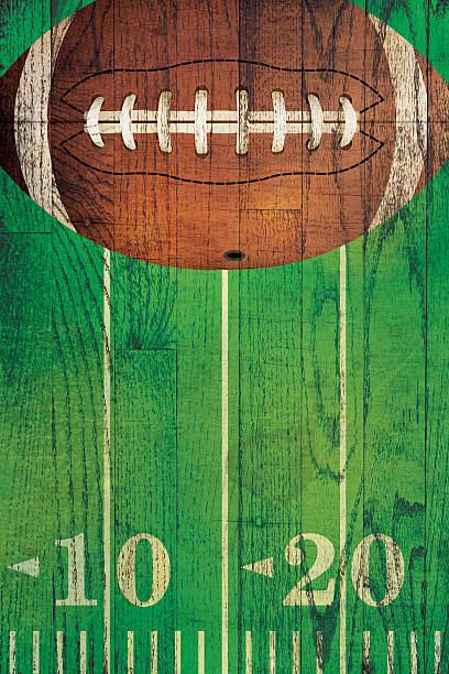 Vintage American Football Ball Field Background An American football and field painted over a textured hardwood floor background. tailgate party photos stock pictures, royalty-free photos & images