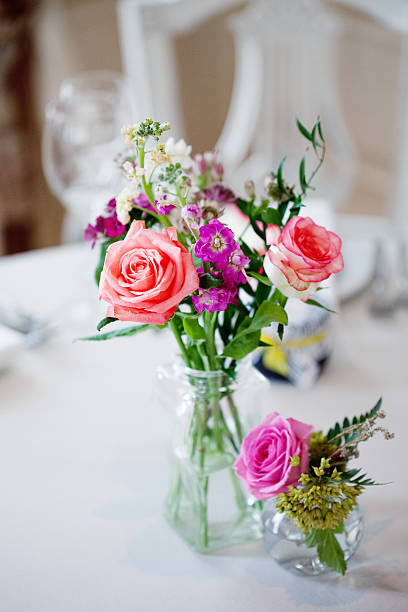 istock Wedding banquet, small restaurant. Floral decor in red, informal style. 595759414