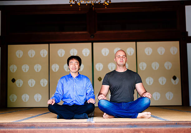 istock Two people in Chijon-ji Shrine meditating after hard working day 595760014