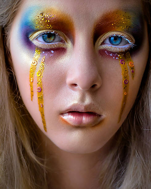 istock girl portrait with creative colorful rainbow makeup 595760016