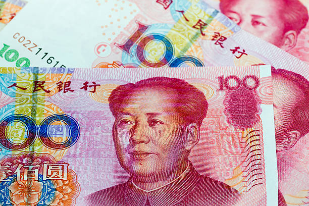 istock Chinese economy image.  Chinese Renminbi banknote. 595760558