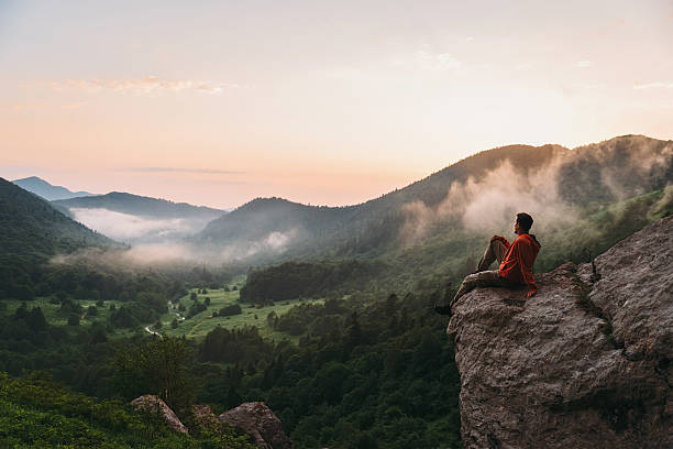 istock Traveler enjoying view of sunset 595761318