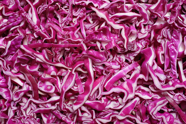 Shredded red cabbage background Shredded raw red cabbage as an abstract background texture red cabbage stock pictures, royalty-free photos & images