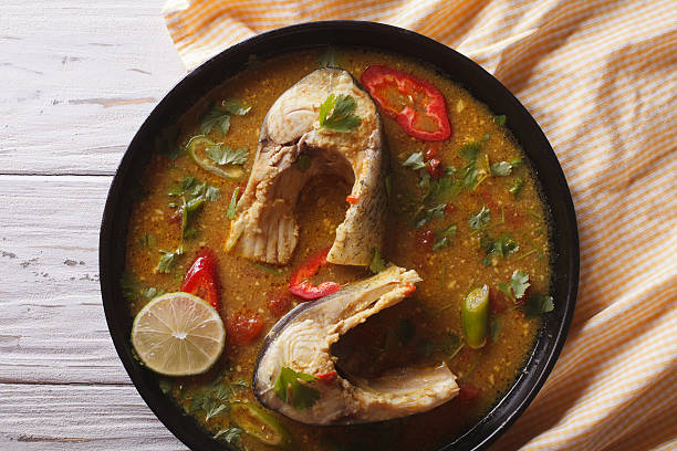 istock Delicious spicy fish curry with cilantro close up. Horizontal 595762498