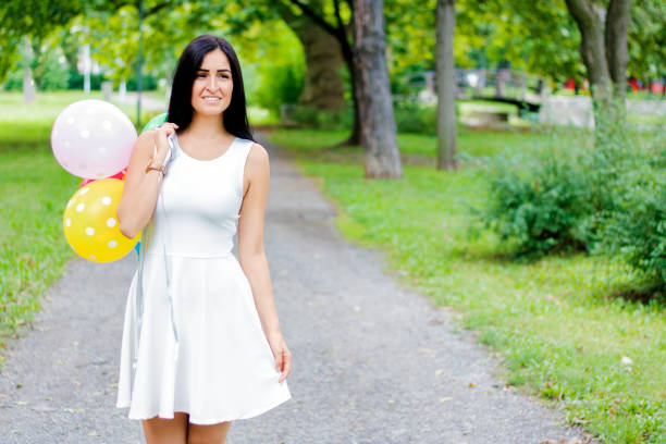istock Girl with balloons 595764906