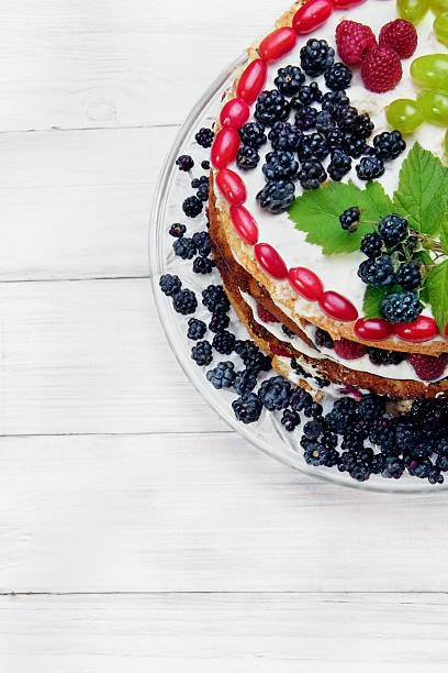 istock Cake with whith, fruits (grape) and berries (raspberry and black 595766748