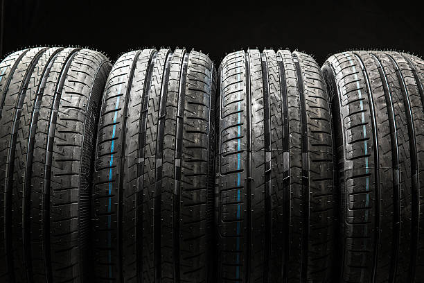 istock Stack of brand new high performance car tires 595766756