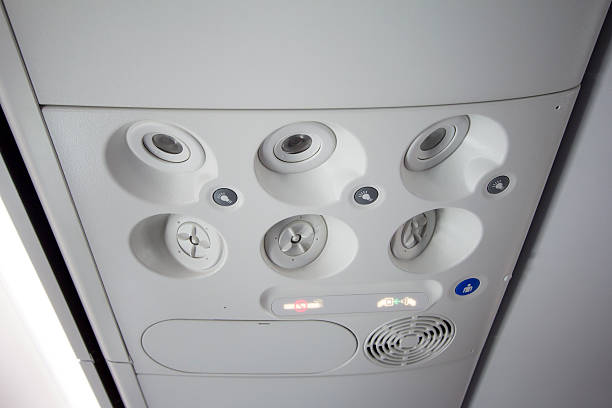 istock reading light, air condition and sign on plane 595766896