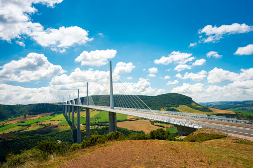 Millau, France - August 1, 2016: bridge at Millau. Millau Viaduct is designed by the French engineer Michel Virlogeux and British architect Norman Foster. It is the tallest bridge in the world.  In south of France part of Autoroute A75 over river Tarn.