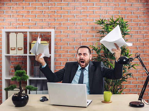 istock Angry businessman at office 595768218