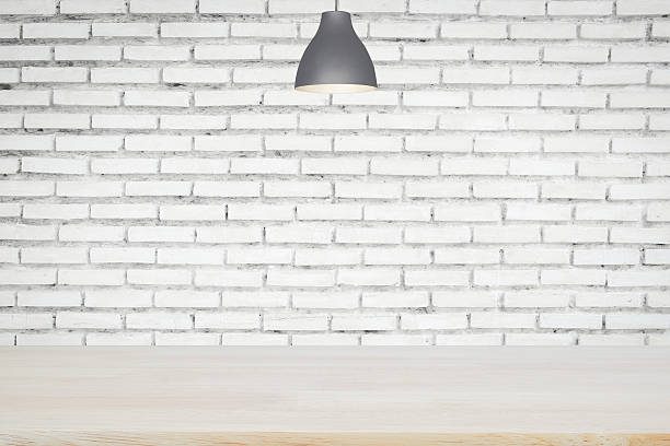 istock Wooden floor and old lamp with old brick wall. 595769954