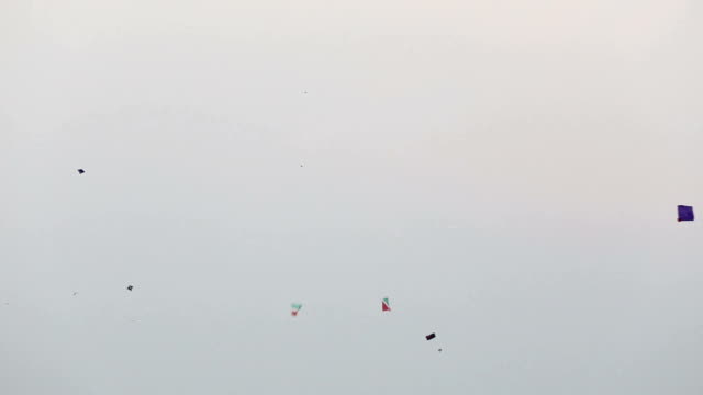 Kites flying over blue sky