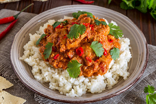 istock Chicken curry with rice and cilantro. 596041252