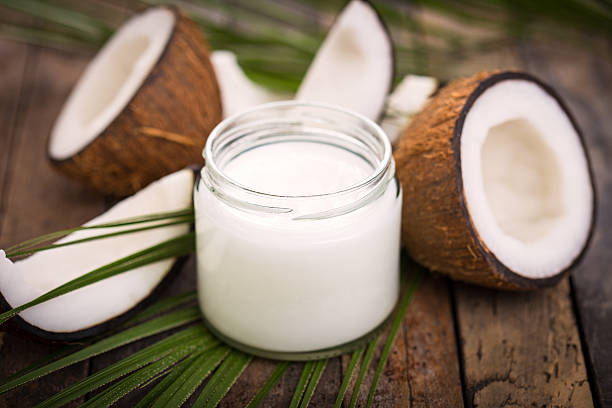 istock Coconut oil on the wooden table 596041866