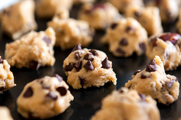 istock Closeup of chocolate cookies dough on baking tray 596047358