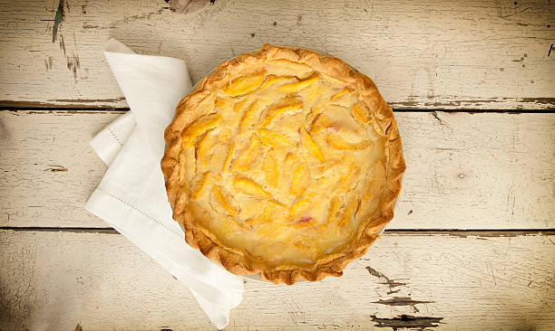 istock Peach Pie on Old White Wood Background 596047850