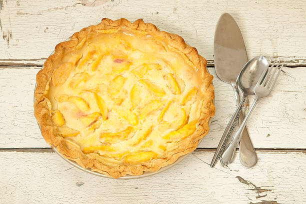 istock Peach Pie on Old White Wood Background 596047884