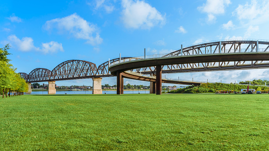 The Big Four pedestrian bridge spans the Ohio River from Louisville KY to Jeffersonville, IN.  Openned to pedestrians in 2013 the bridge was built as railroad bridge in 1895.