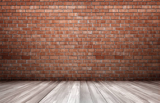 istock Red brick wall and wooden floor 596049916
