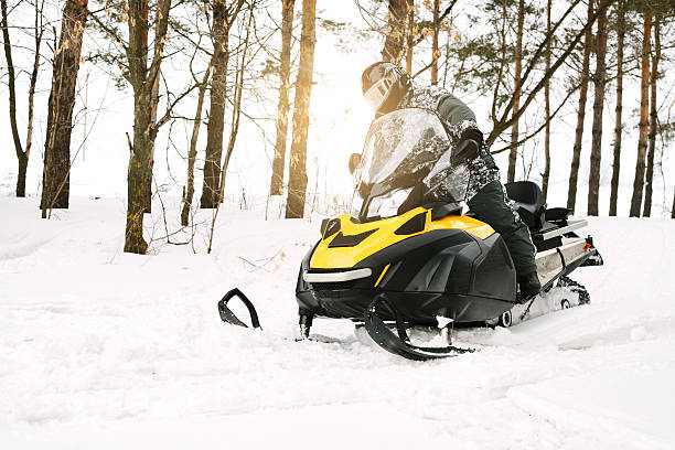 istock Man on snowmobile. Winter sports. 596050530