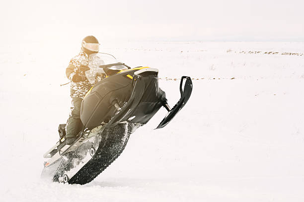 istock Man on snowmobile. Winter sports. 596050602