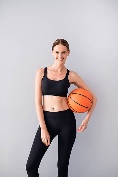 istock Nice young woman holding ball 596054240