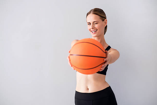 istock Funny young woman with ball 596054272